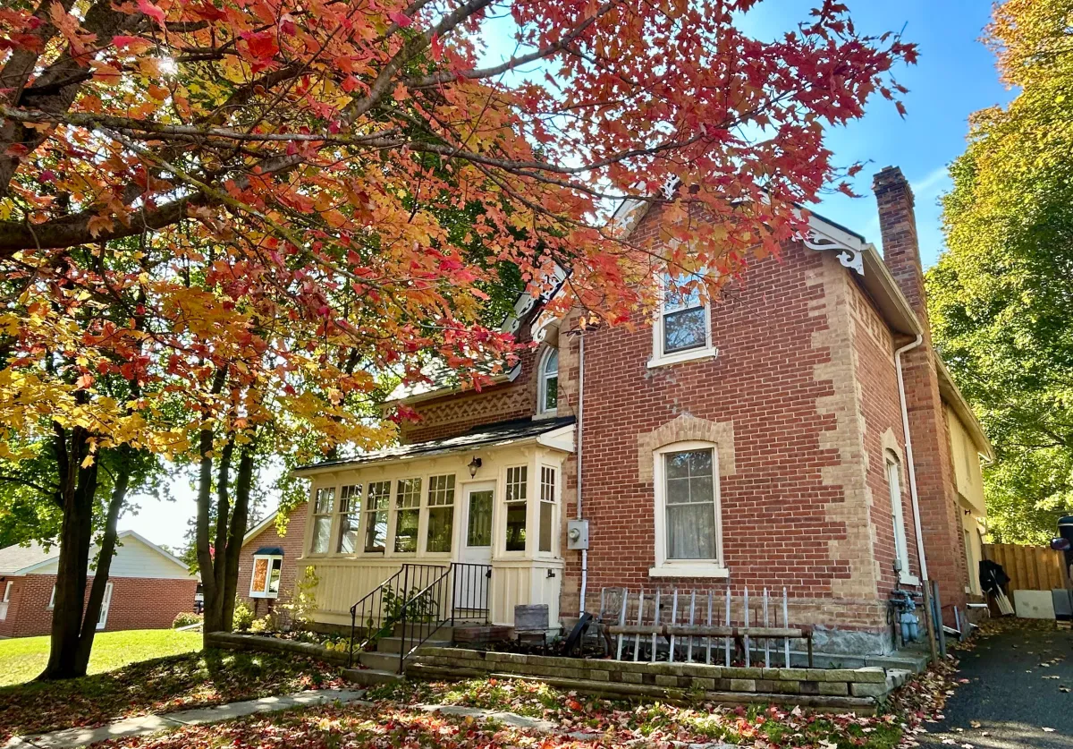 Picture of a 2-storey red brick century home located in Grand Valley, Ontario