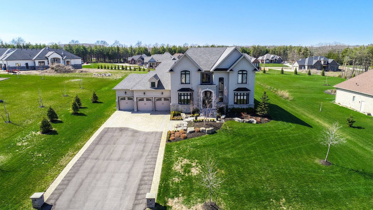 Image of a large multi-storey home on a spacious property located within the Rayburn Meadows neighbourhood of East Garafraxa