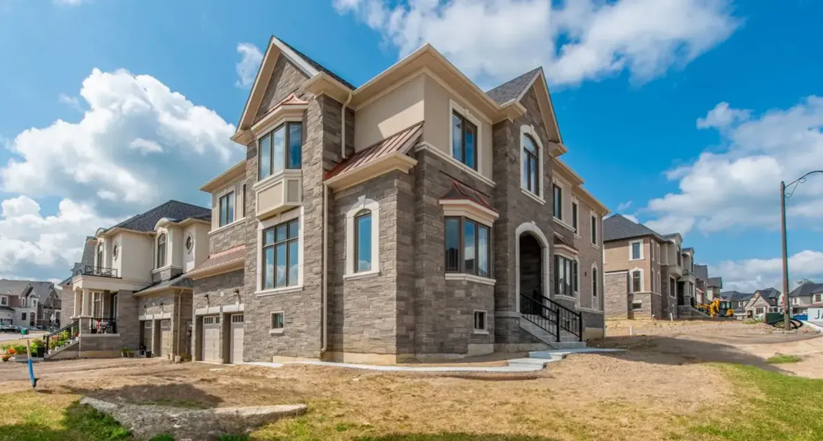 Large stone 2-storey newer-build home with attached 2-car garage located in Caledon Village