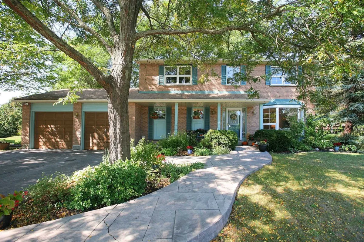 2-Storey detached home with attached 2-car garage surrounded by mature trees located in Palgrave, Ontario