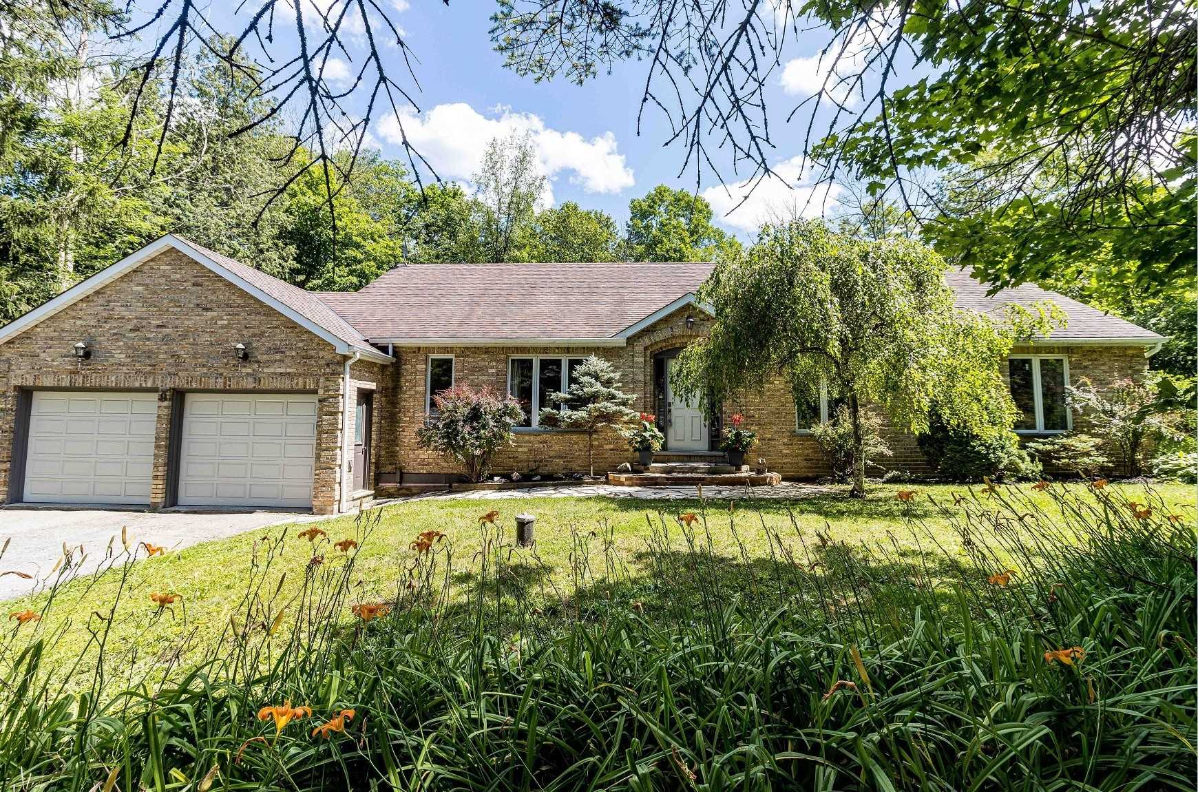 Large all brick bungalow with attached 2-car garage located in Belfountain, Ontario