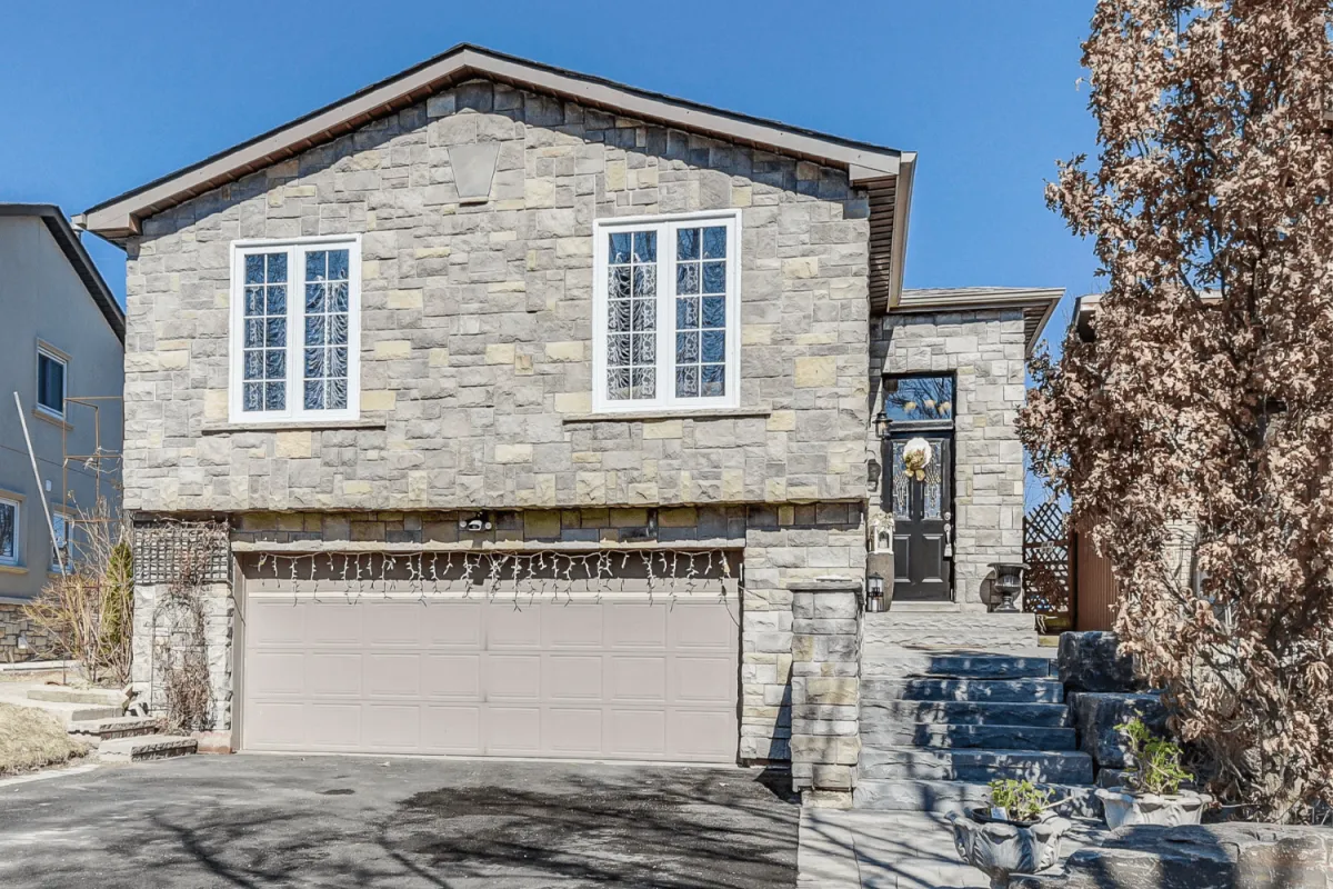 2-storey grey stone detached home with attached 2-car garage located in Bolton North, Caledon