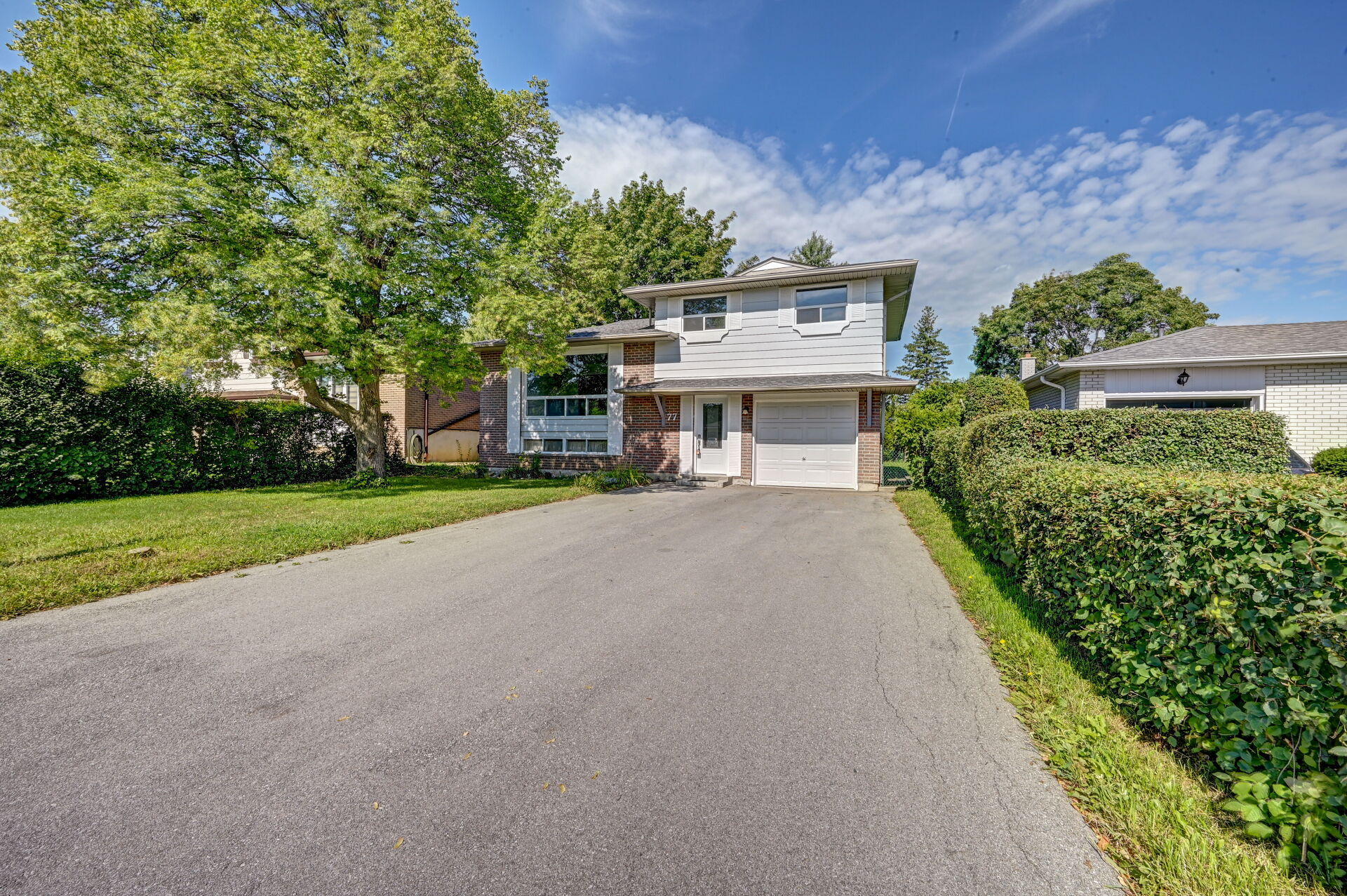 sidesplit home with built in garage and mature tree in Bolton East, Caledon
