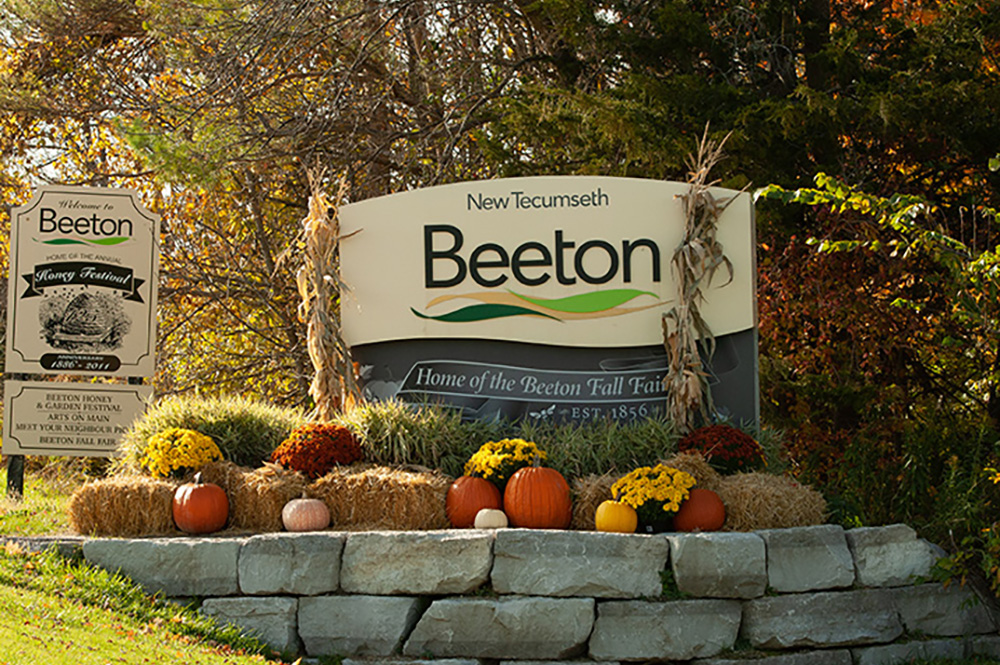Image of the welcome to Beeton sign decorated for fall, in Beeton, Ontario
