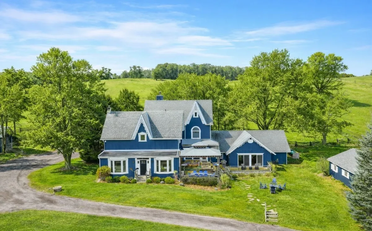 2-storey country home surrounded by greenery located in the Earnscliffe area of Mulmur Township