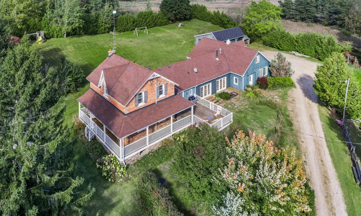 Large century home with wrap around veranda located in the Whitfield area of Mulmur Township