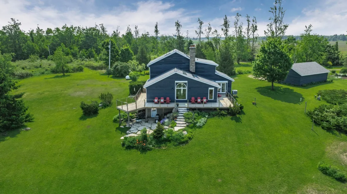 Spacious home with stone walkway and patio and detached garage located in the Lavender Area of Mulmur Township