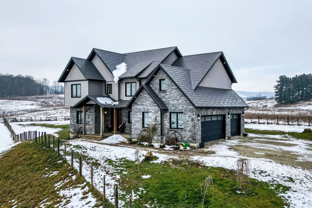 2-storey grey stone home located in the Banda area of Mulmur Township