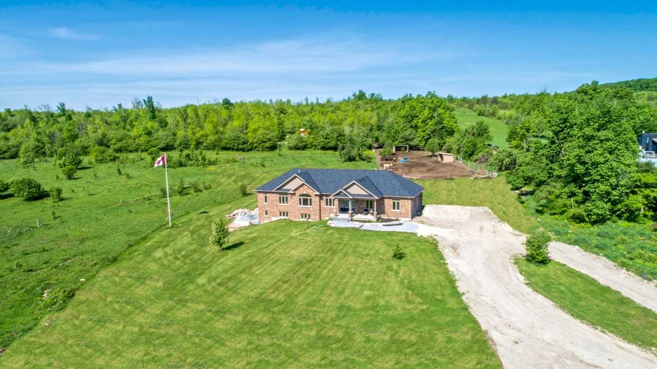 Spacious home with large looping driveway and large property located in the Banda area of Mulmur Township