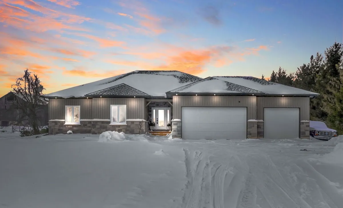 Bungalow home with attached 3-car garage located in the Honeywood area of Mulmur Township