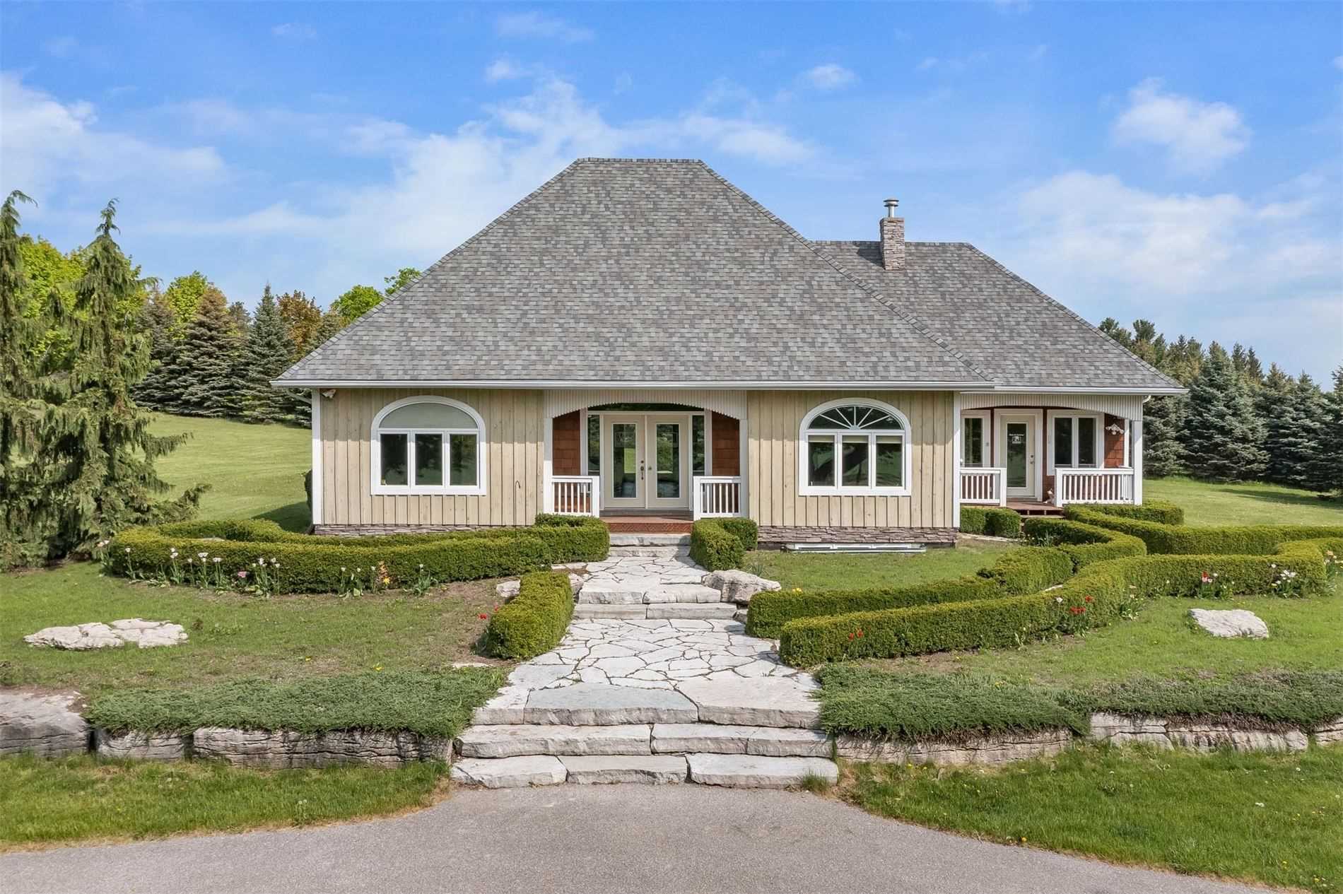 Beautiful home with lush landscaping located in the Airlie area of Mulmur Township