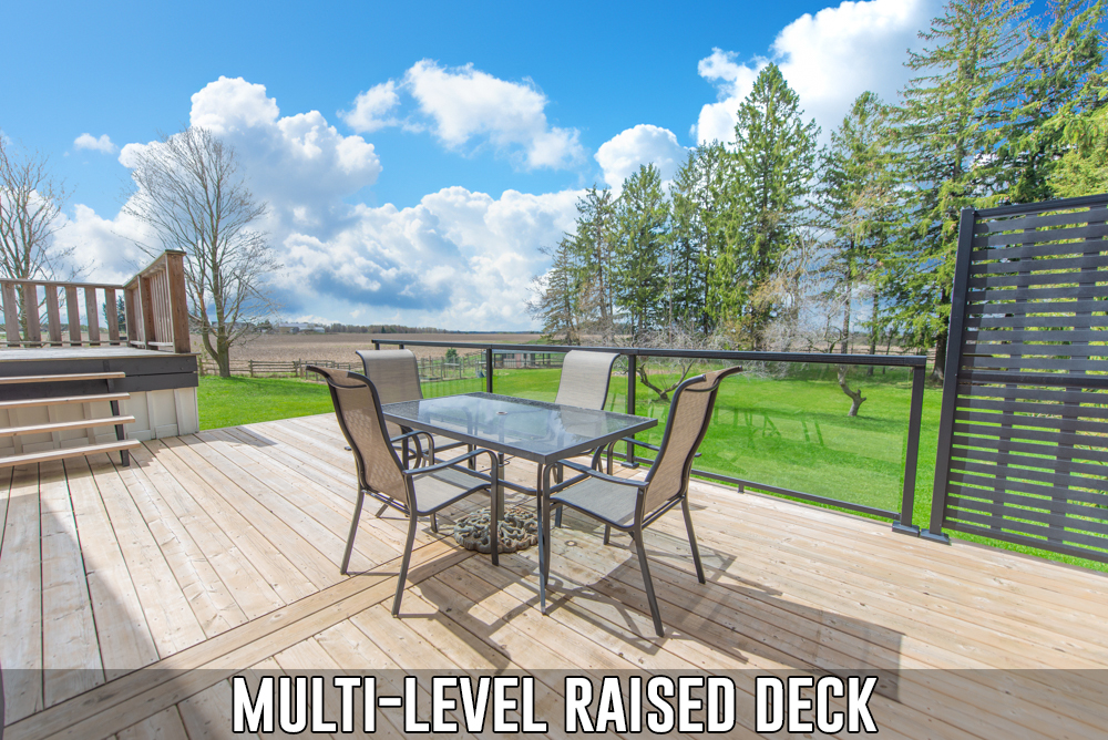 Multi-level deck overlooking rear yard located at 586274 County Road 17, Mulmur