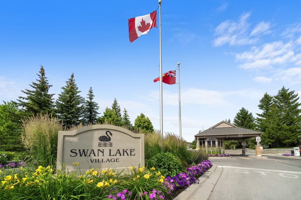 Welcome sign at the front gates of Swan Lake Village in Markham