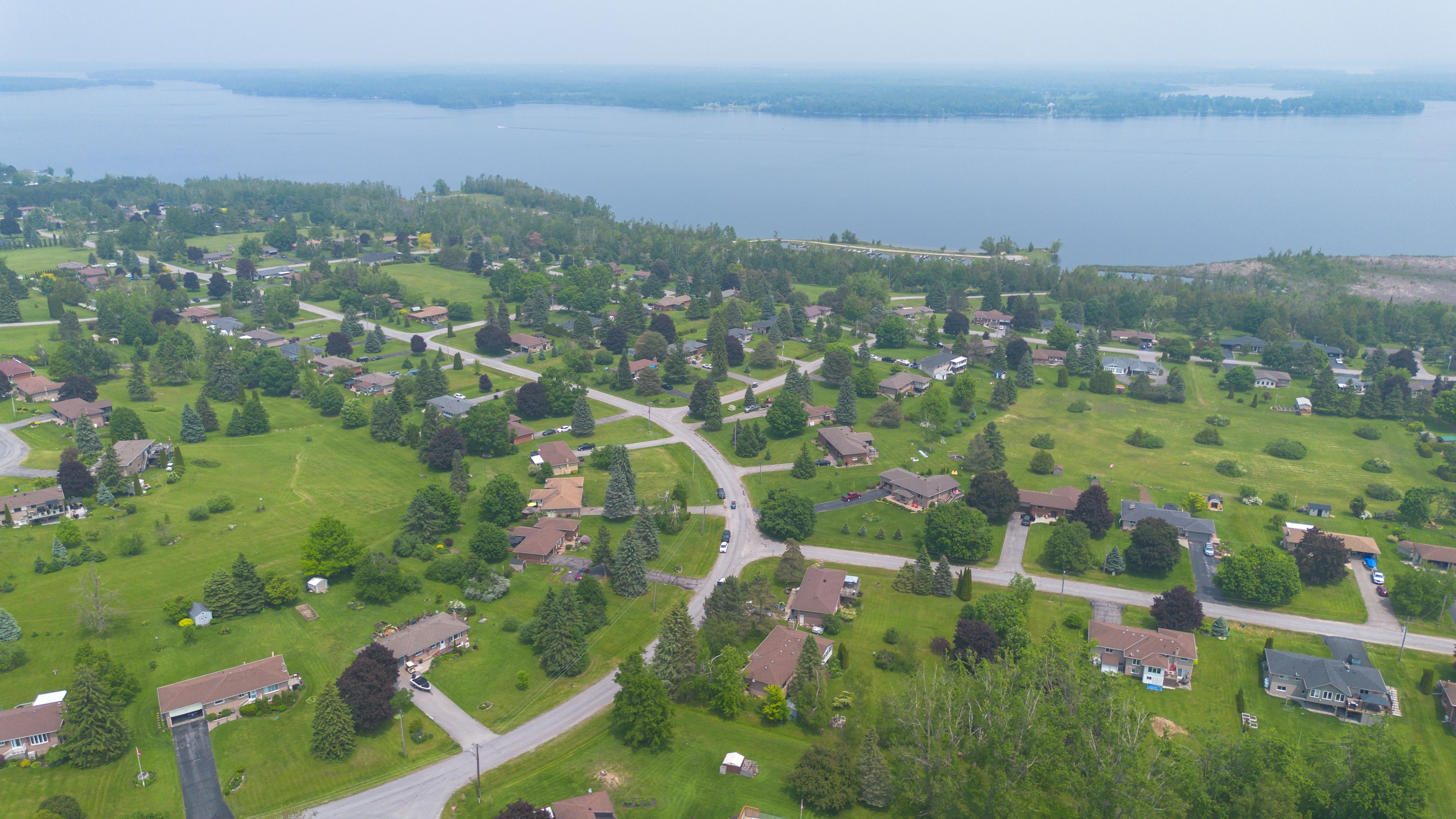Aerial image of the Victoria Place community overlooking Pigeon Lake