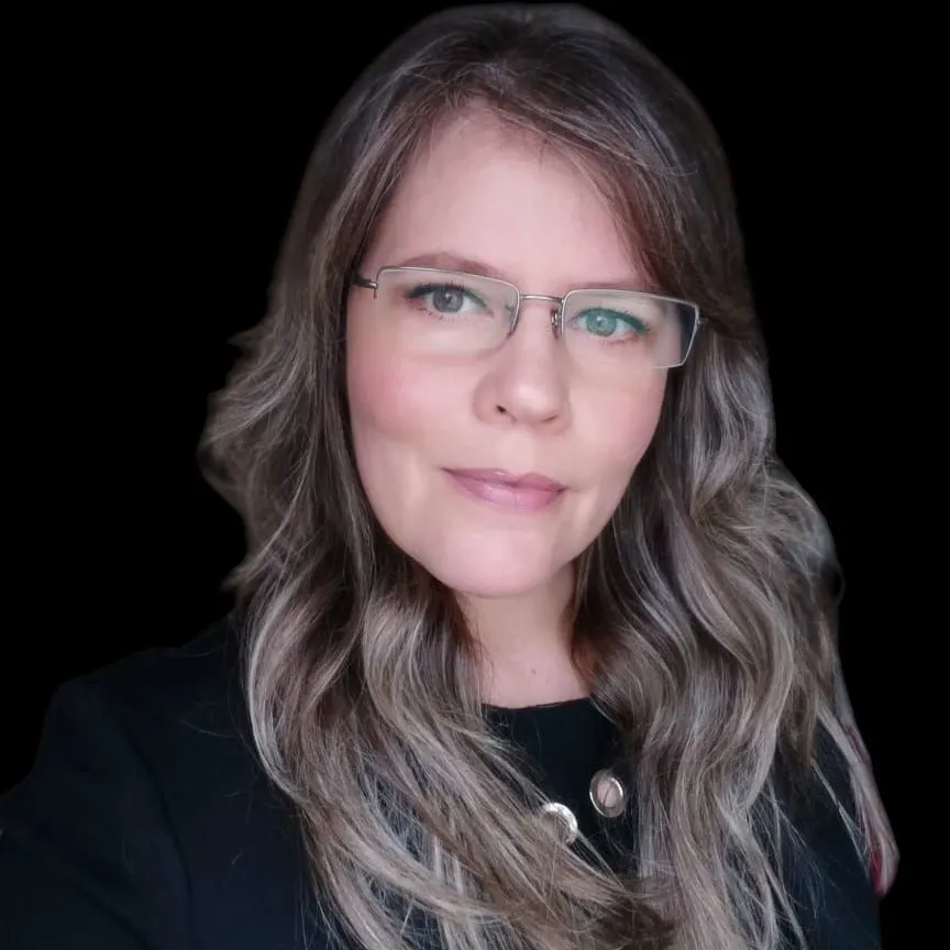 Medical professionals practice a dental procedure on a mannequin.