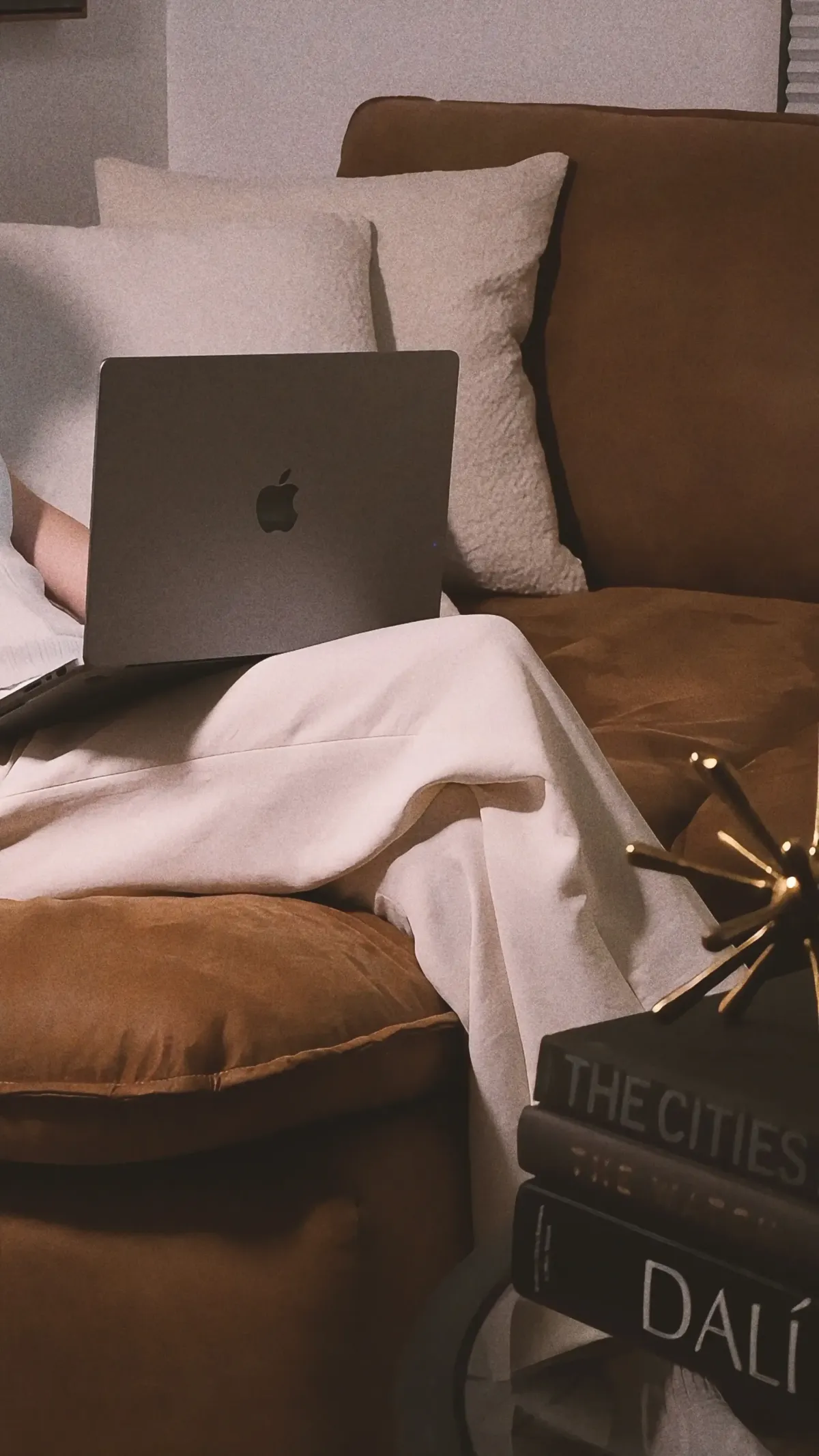 Lap on laptop in living room scene