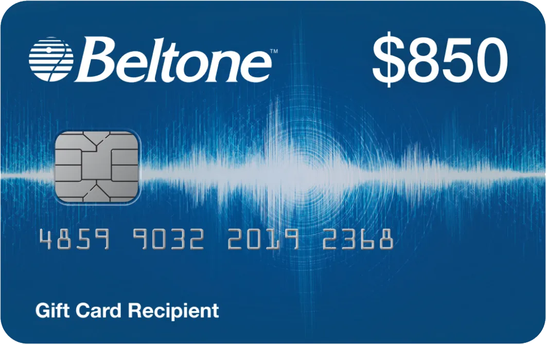 a man standing on a beach surrounded by seagulls