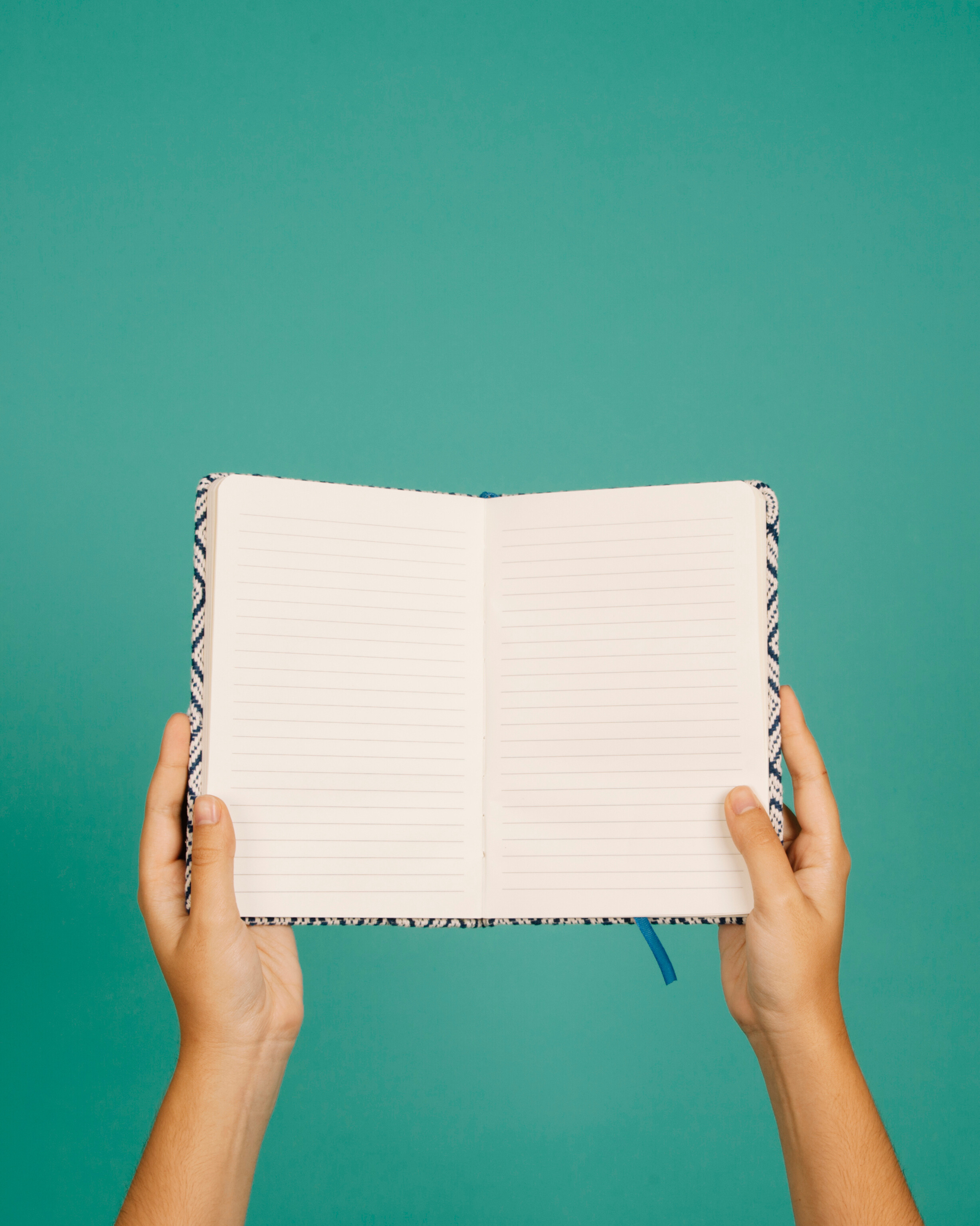 Hands holding an open book symbolizing author guidance and self-publishing support from D.R Online Publishing