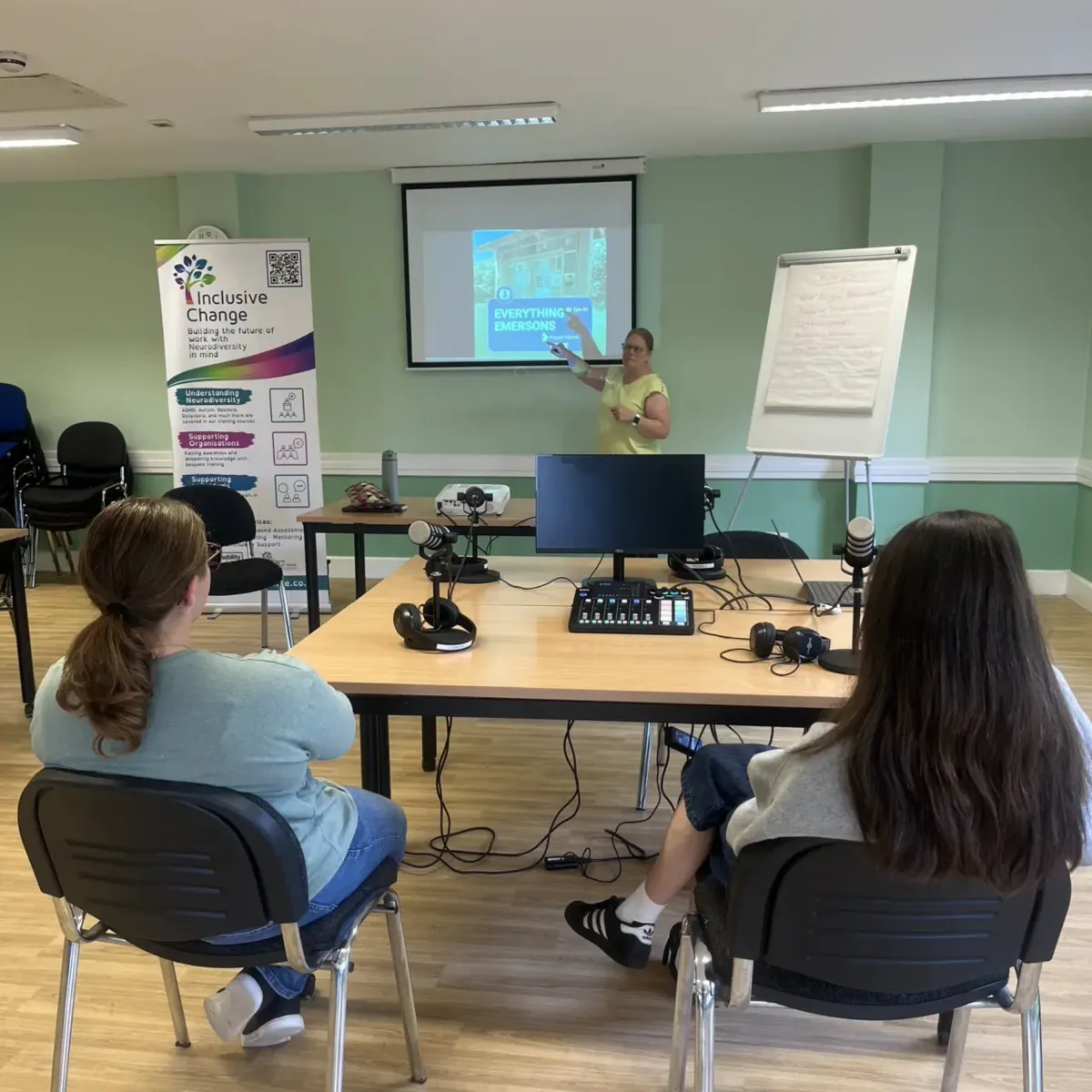 Participants learning how to edit in front of a computer 