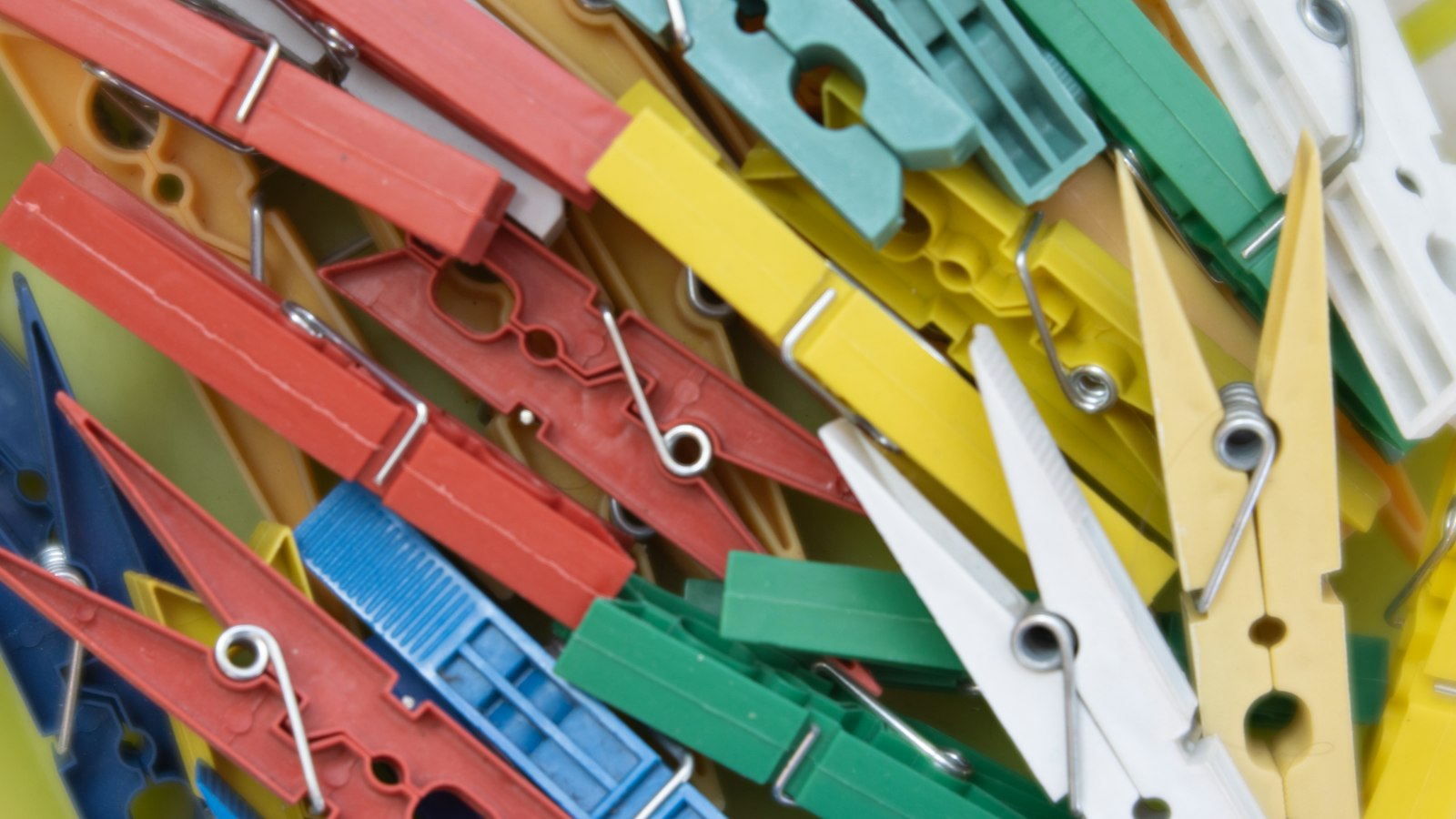 Pile of colourful clothes pegs