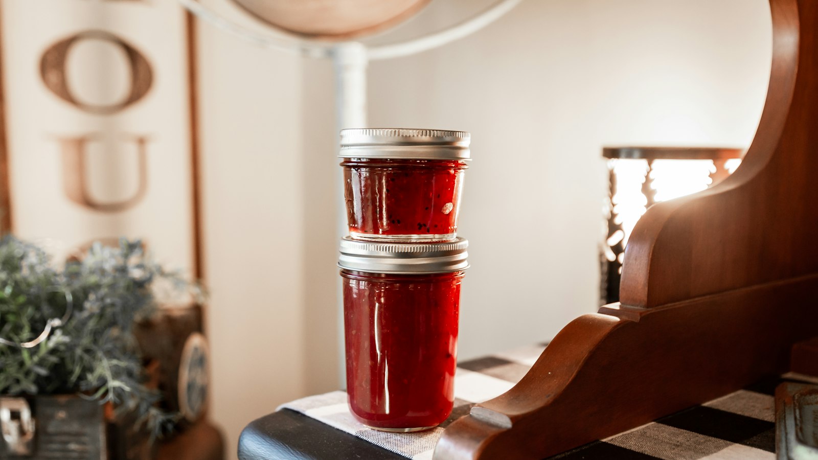 Jars of homemade jam on a kitchen table