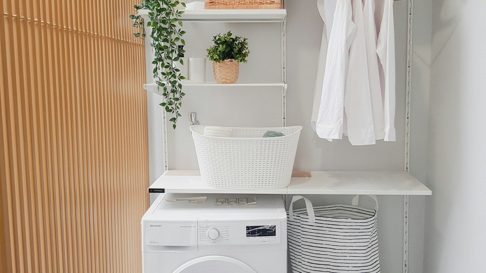 Front-load washer in a bright home laundry nook