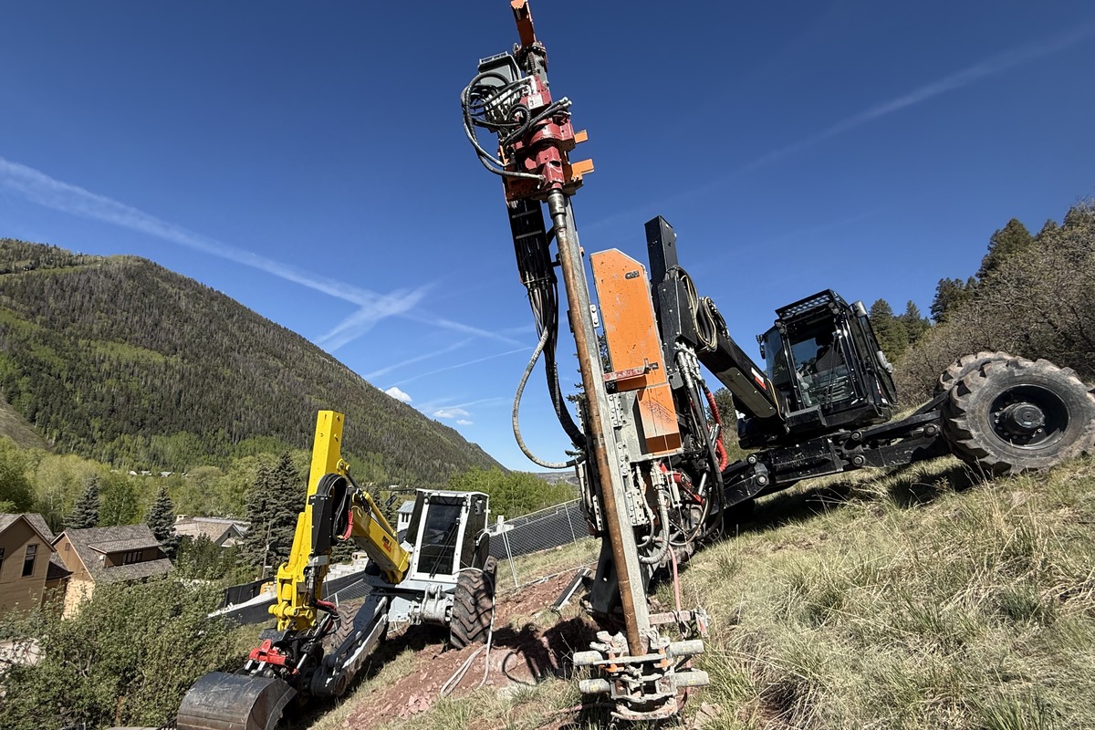 General contractor operating drilling equipment