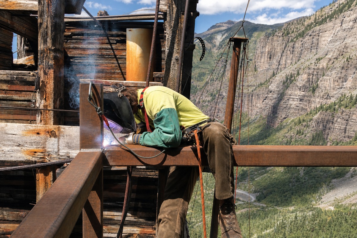 Welder working with protective equipment