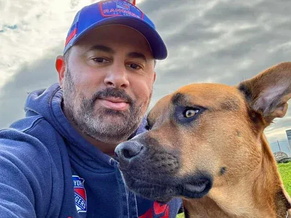 MD Clean business owner with dog representing friendly local trash can cleaning company