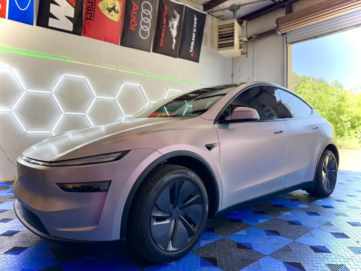 Rose gold Tesla Model Y with window tint at Venom Tint Acworth