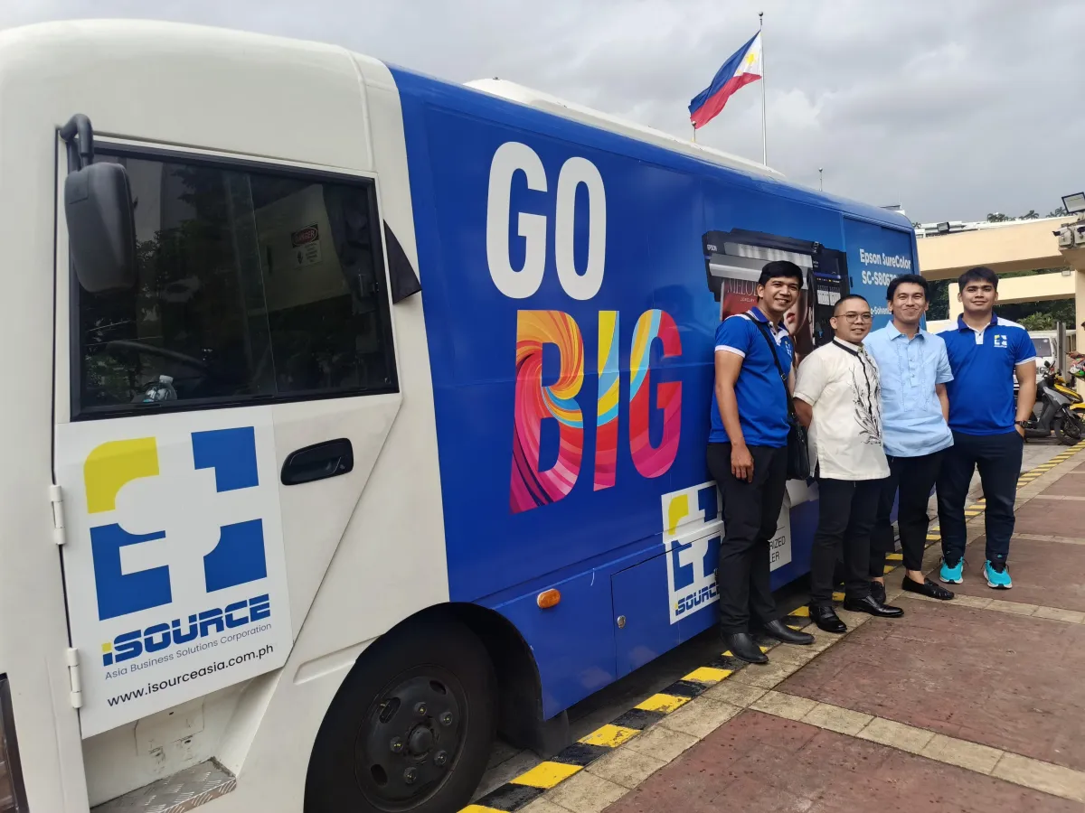 Business owners testing industrial equipment inside demo bus