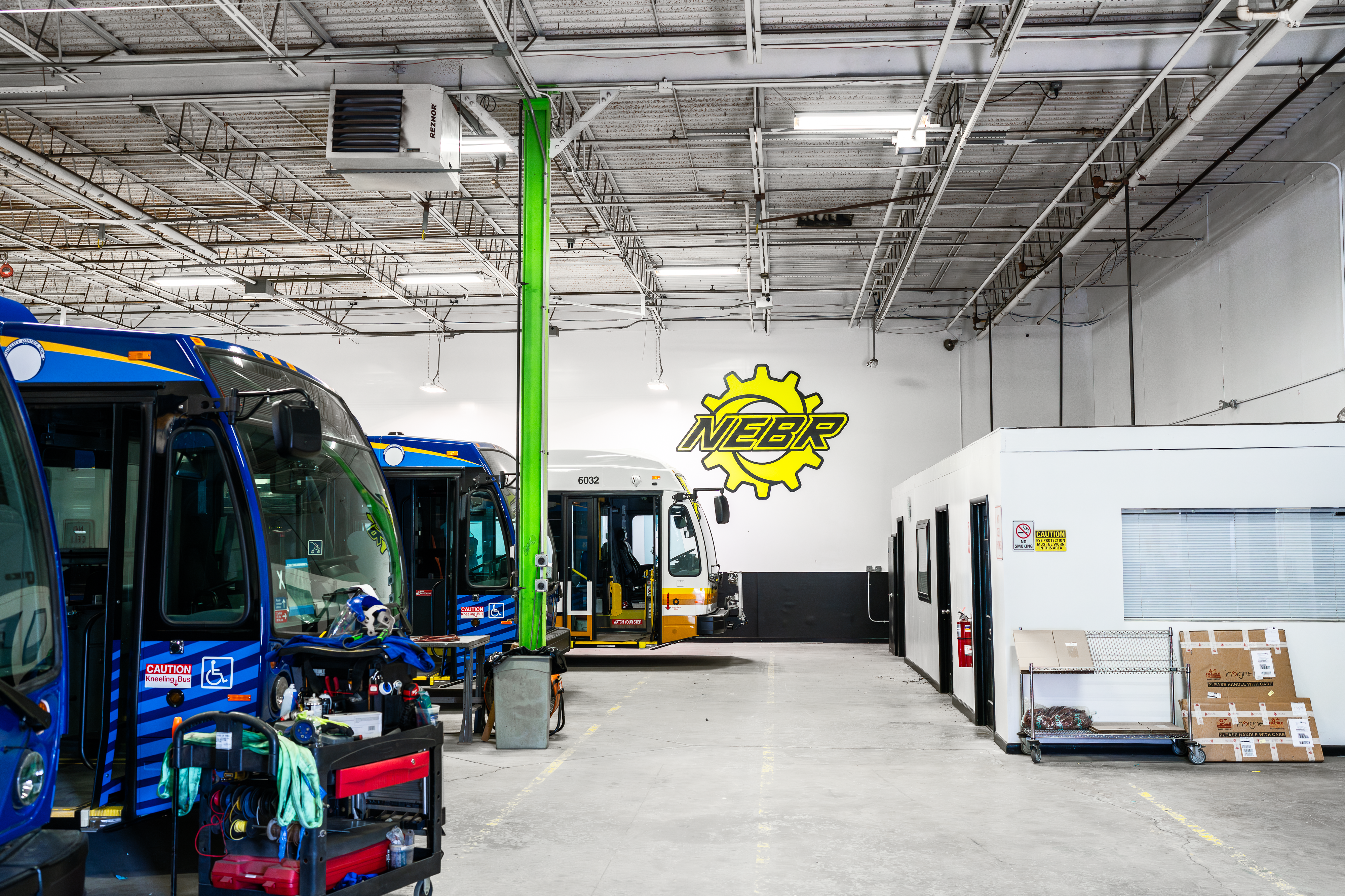 Transit buses inside NEBR service shop for aftermarket extended warranty support