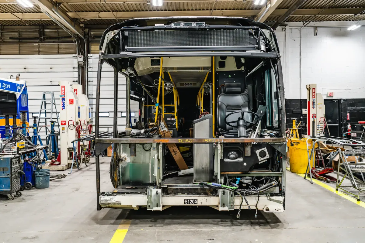 Transit bus stripped for structural repair and fabrication at NEBR