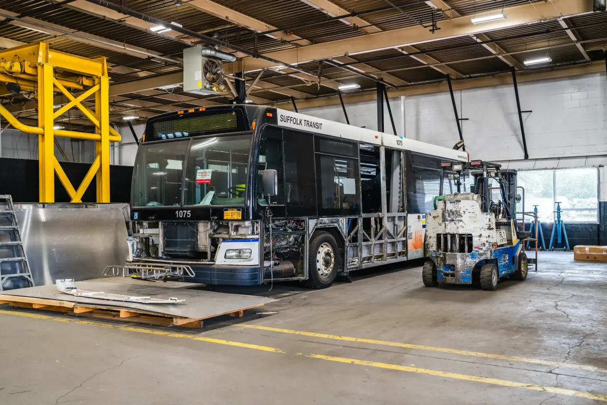 Transit bus undergoing mid-life overhaul inside NEBR facility