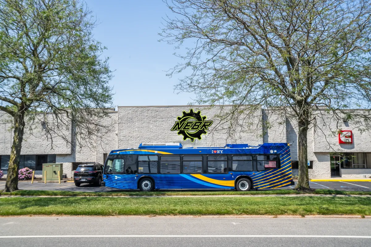 Hybrid electric bus parked outside NEBR facility during pre-delivery inspection