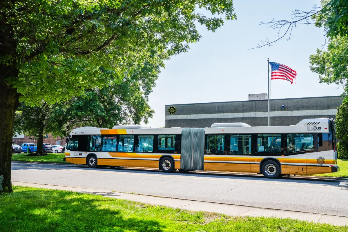 New transit bus parked outside NEBR facility during pre-delivery inspection