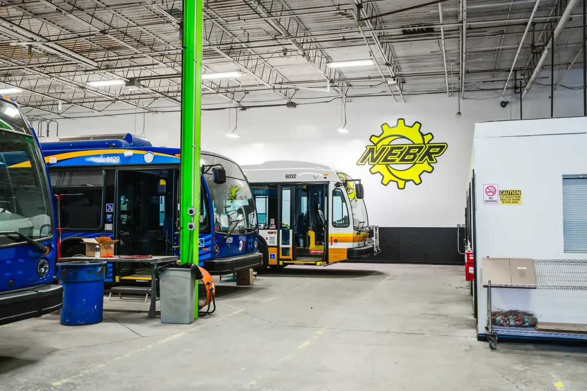 Transit buses inside NEBR service shop for aftermarket extended warranty support
