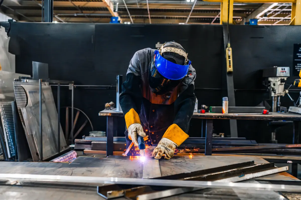 Technician welding metal components