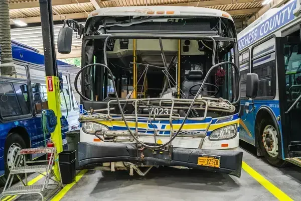 Bus undergoing body repairs and structural restoration in the NEBR maintenance shop