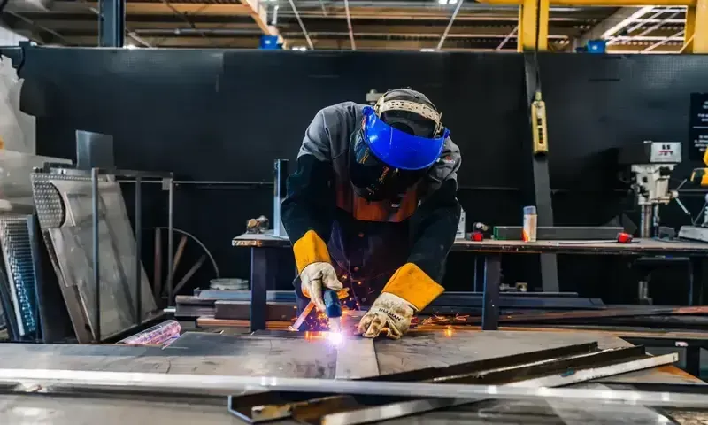 Technician welding metal components
