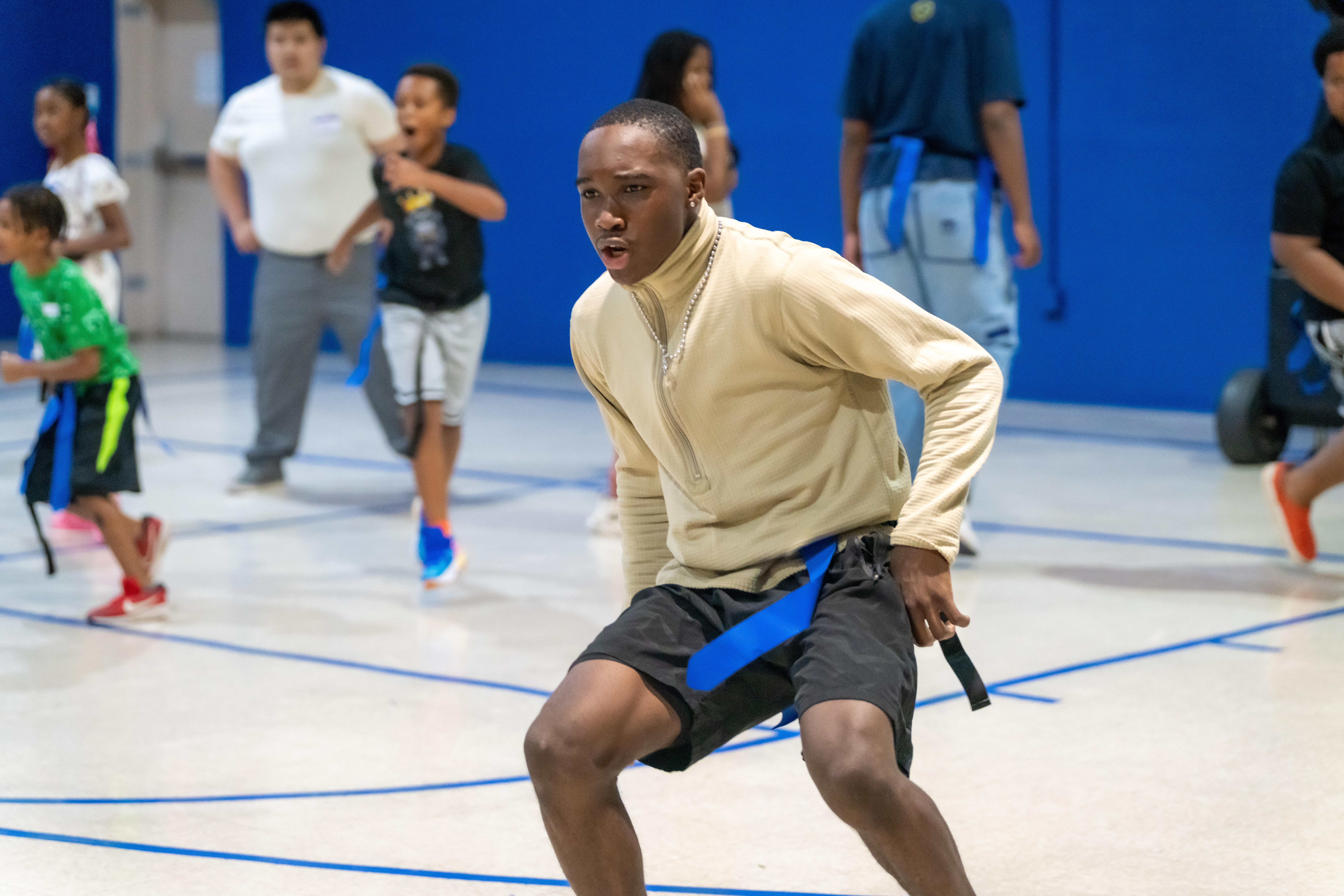a group of people standing on top of a wooden ramp