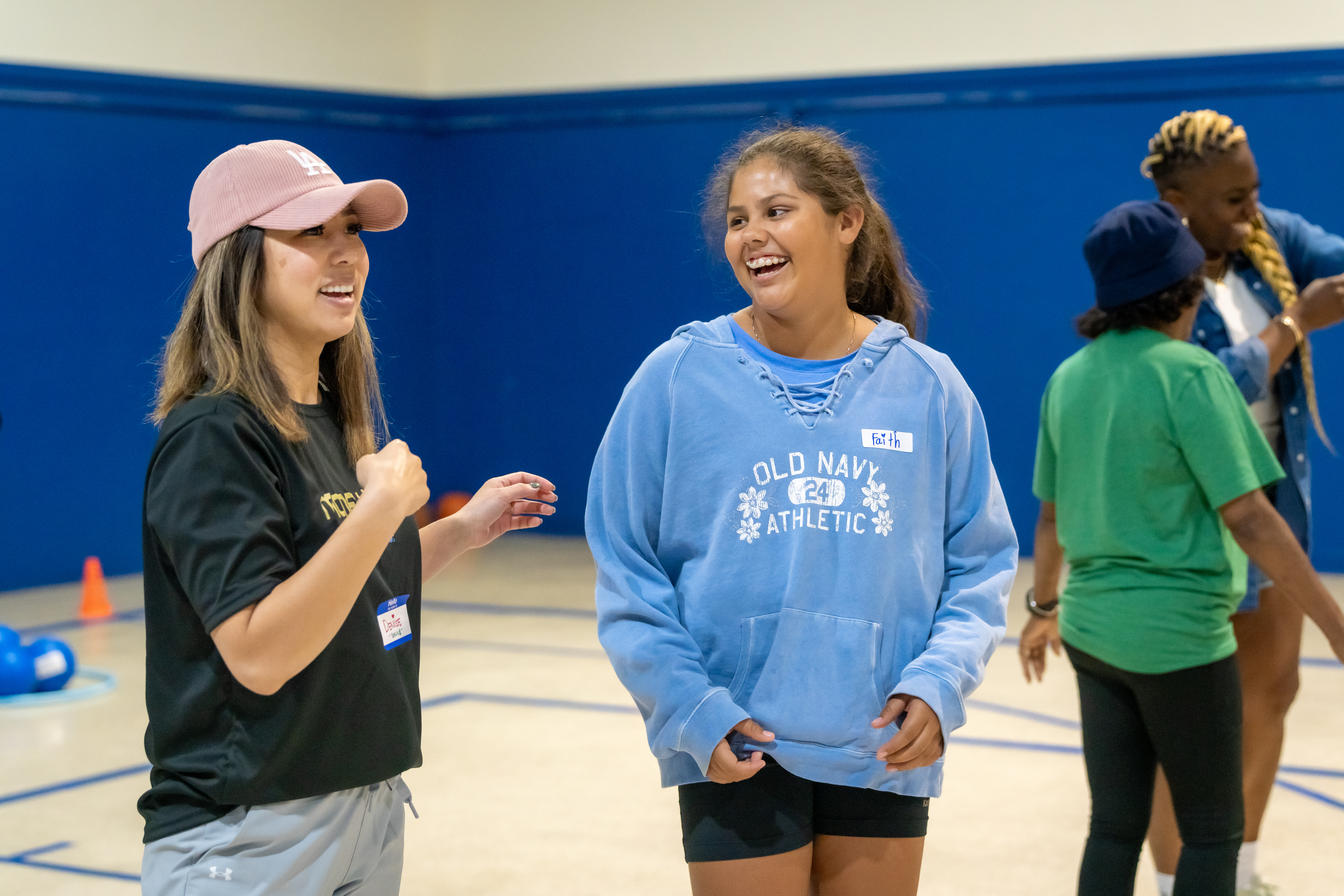 two children are playing with a jar of money