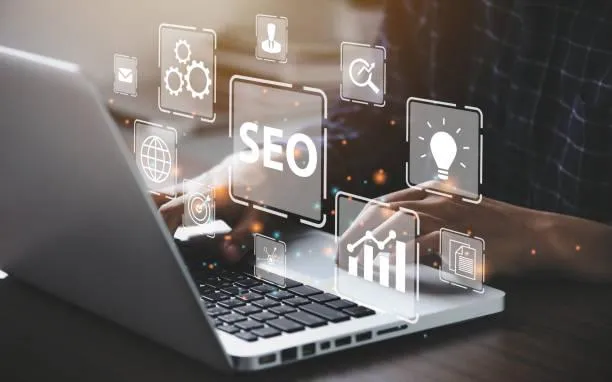 Person typing on a laptop with overlay icons representing SEO strategies, analytics, and digital marketing tools.