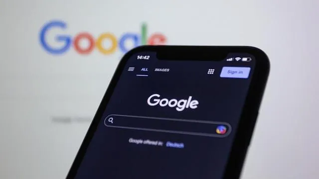 Smartphone displaying Google search page, highlighting importance of Google Business profile optimization for brand visibility and customer engagement.