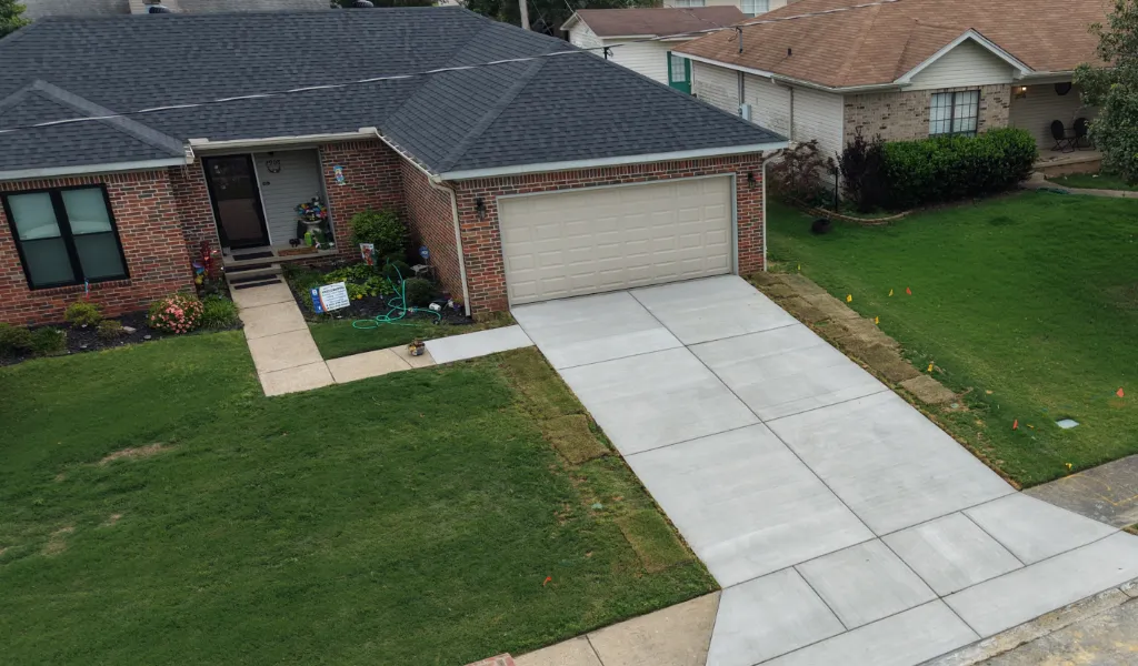 A family residual home with a new concrete driveway.