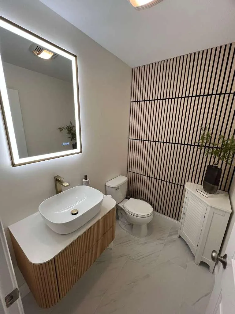 woman holding white mug while standing