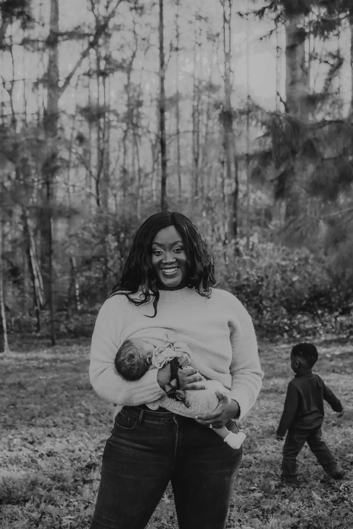 Mother with newborn and toddler, symbolizing Elephant Baby's mission to redefine postpartum as a lifelong journey of healing and support.