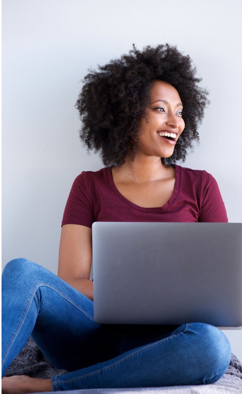 new mother gently holding her newborn baby, receiving compassionate postpartum care from Elephant Baby.