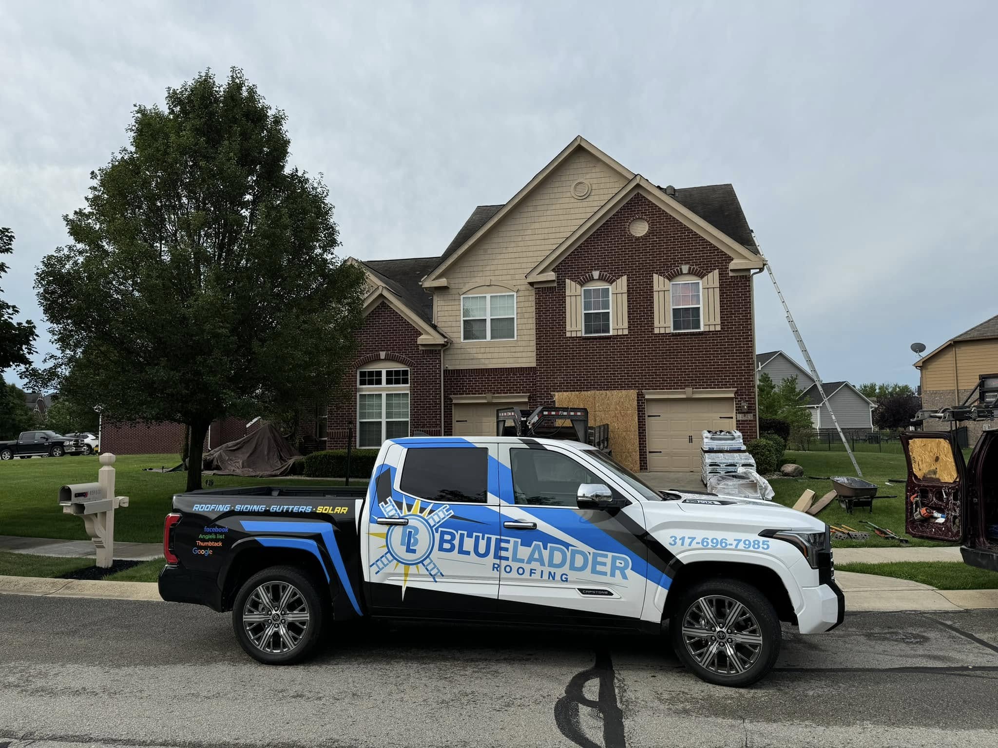 SummitShield Roofing service van parked beside a suburban home at golden hour.