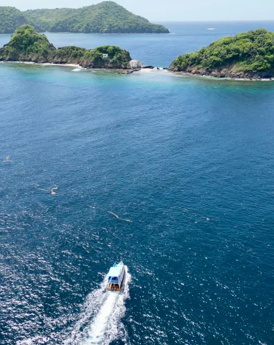 a body of water with a small island in the distance